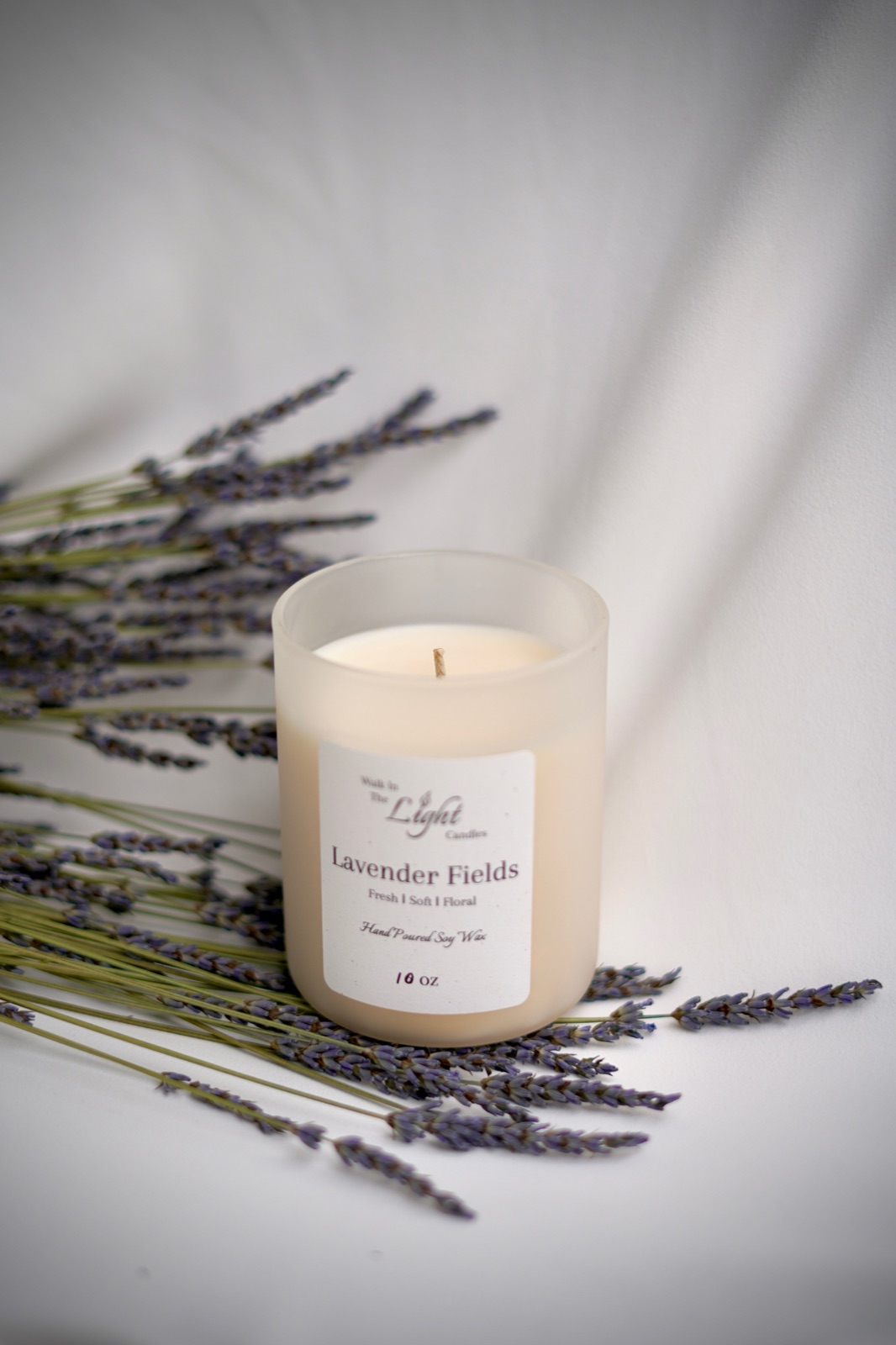 Lavender Fields candle surrounded by lavender